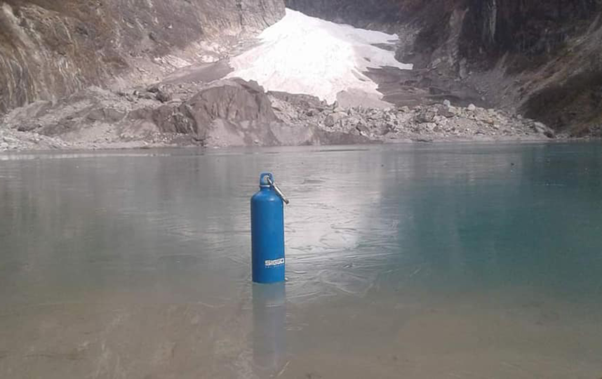 Thermos on top of frozen Kahphuche Lake 